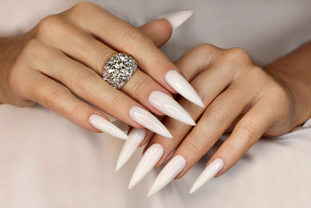 long-light-manicure-with-jewelry-womans-hand